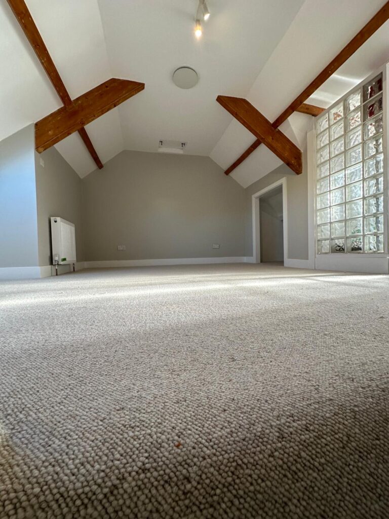 Open plan living room carpet installation